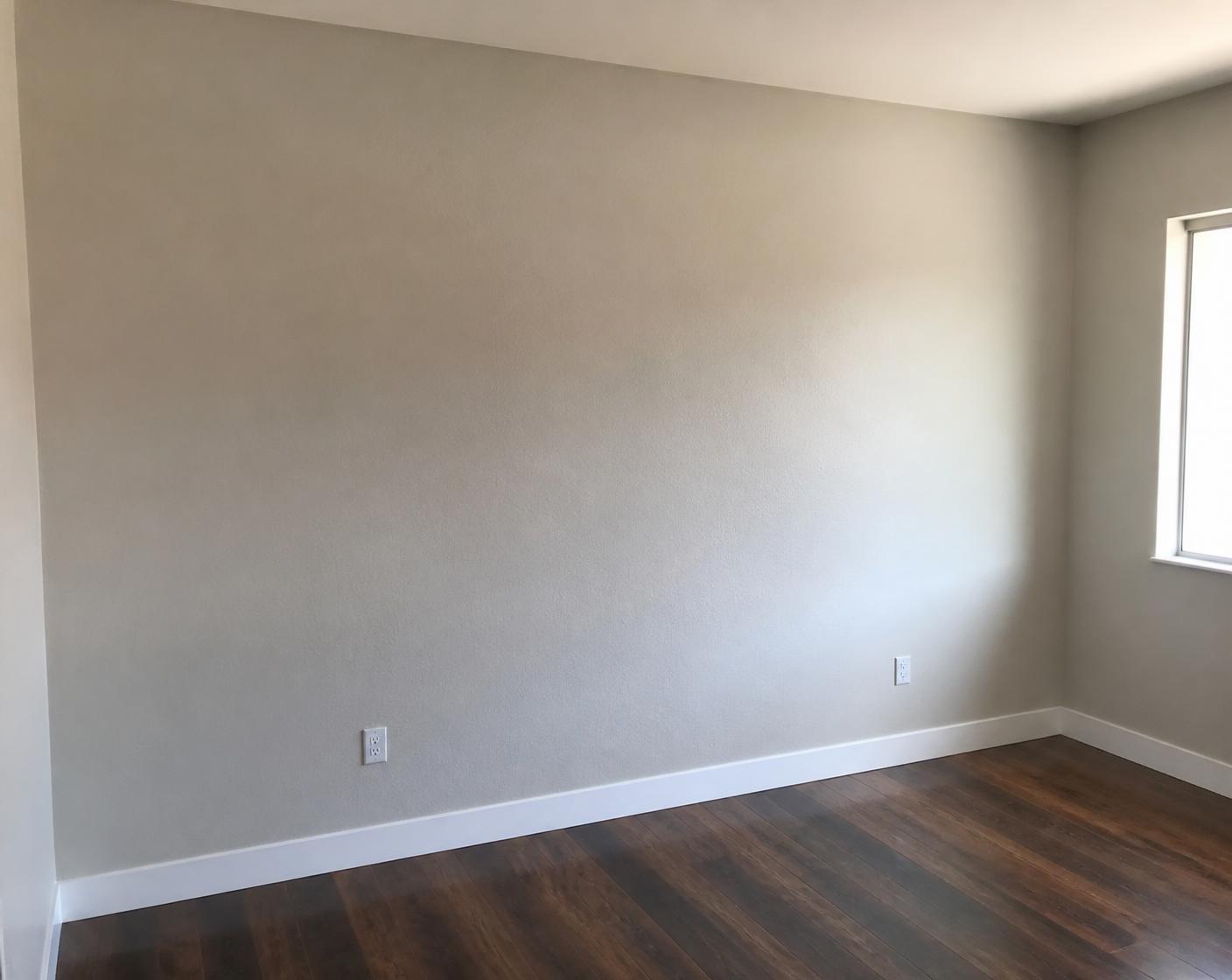 Interior wall after drywall and texture repair, repainted